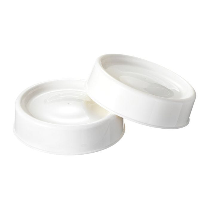 Two white milk storage lids for Tommee Tippee Natural Start® baby bottles. ​