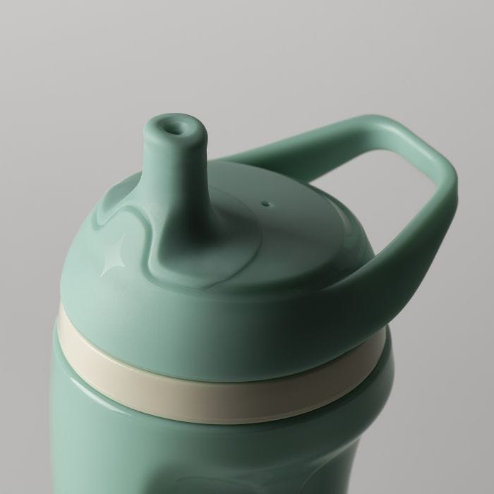 Close up of the spout on a teal insulated sporty spout cup against a light grey background