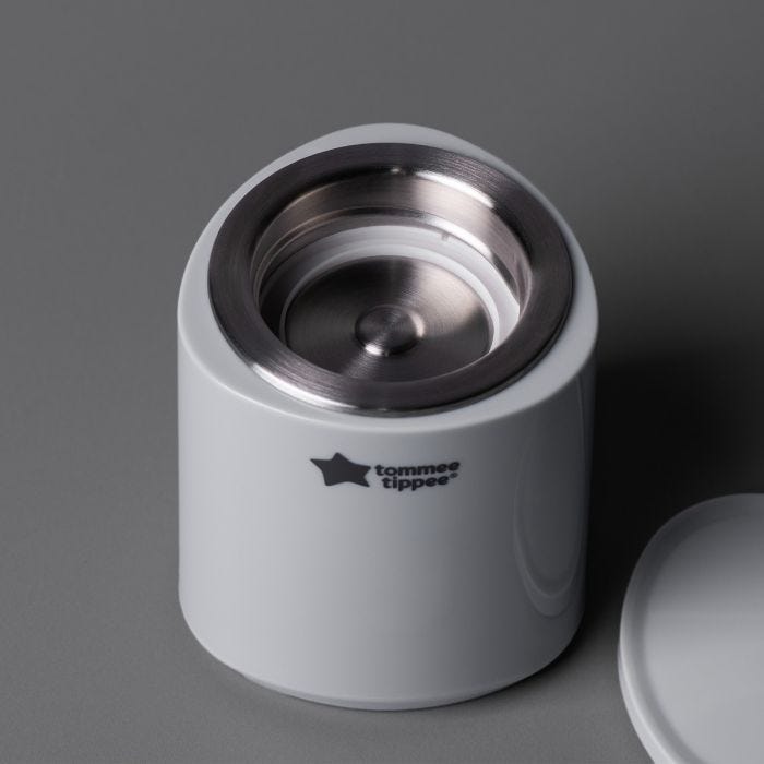Arial shot of the LetsGo Portable Baby Bottle Warmer on a dark grey background.
