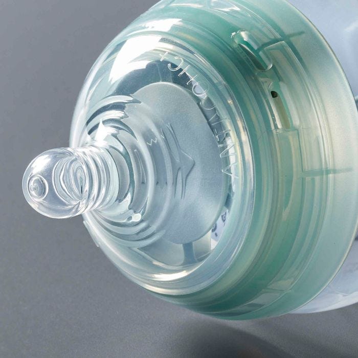 Close up of Advanced Anti-Colic baby bottle on its side showing sterilizing vents and nipple