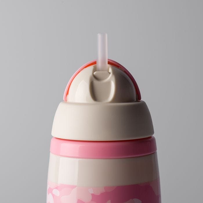 Close up of pink camo insulated straw cup against a light grey background