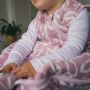 Baby wearing The Original Grobag Botanical Sleepbag