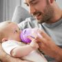 dad-feeding-baby-with-purple-closer-to-nature-baby-bottle