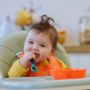 child using Smushee™- first self-feeding spoon