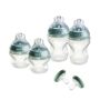 Natural Start Silicone baby bottles and Breast-Like soothers against a white background