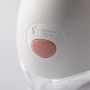 Close up of wearable breast pump on a grey background