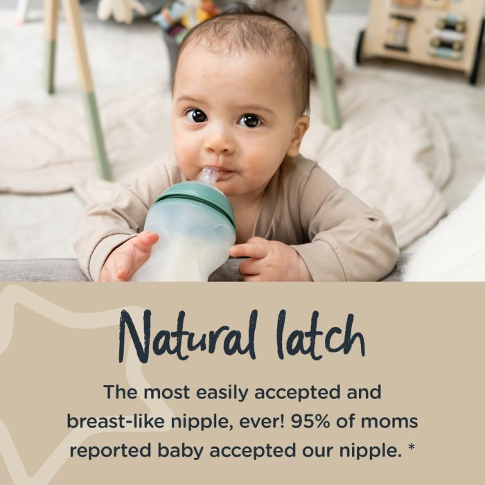 baby holding the teat of a silicone baby bottle in their mouth with text stating 95% of moms say baby accepted this nipple.