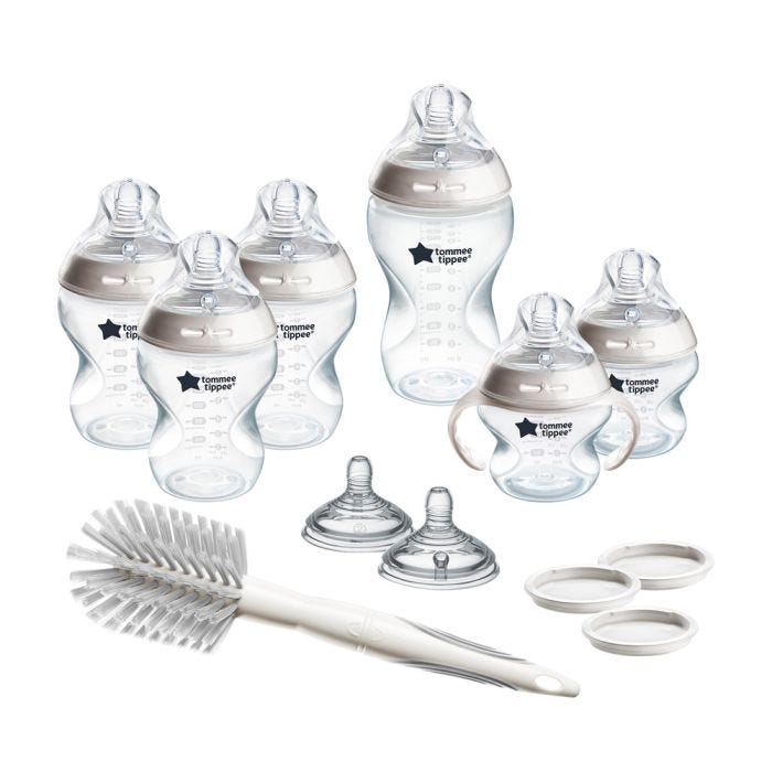 All Grow with Baby bottle set components against a white background