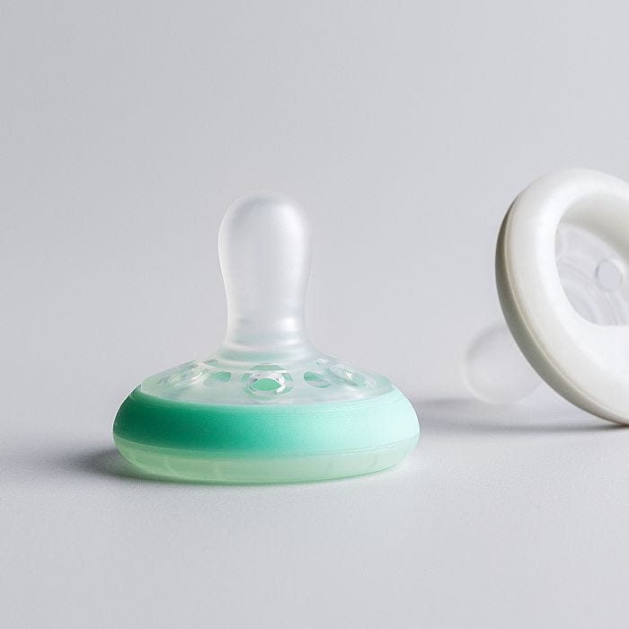 Pacifiers on a grey background