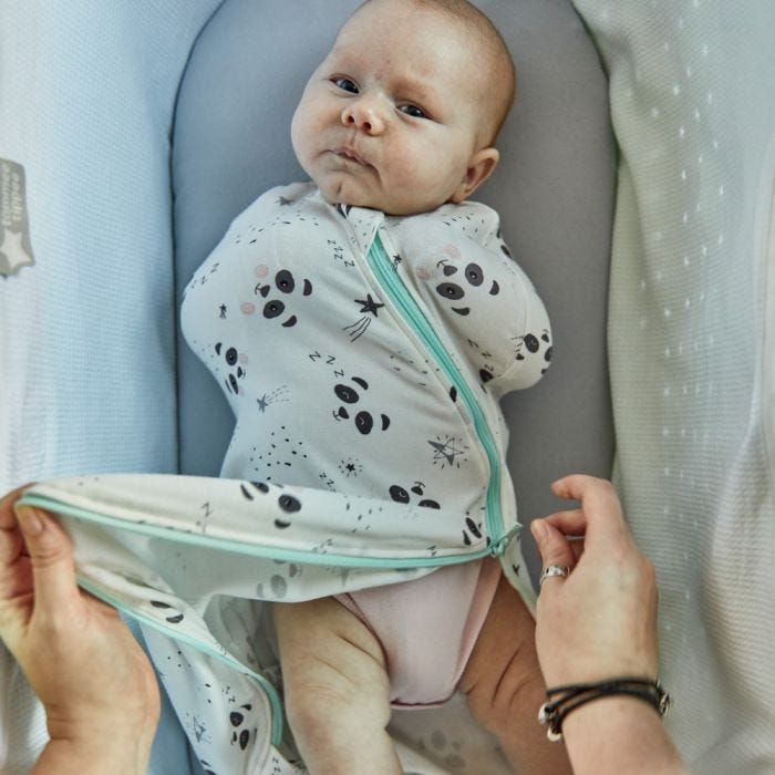 baby being changed using the 2 way zip on the The Original Grobag Little Pip Easy Swaddle