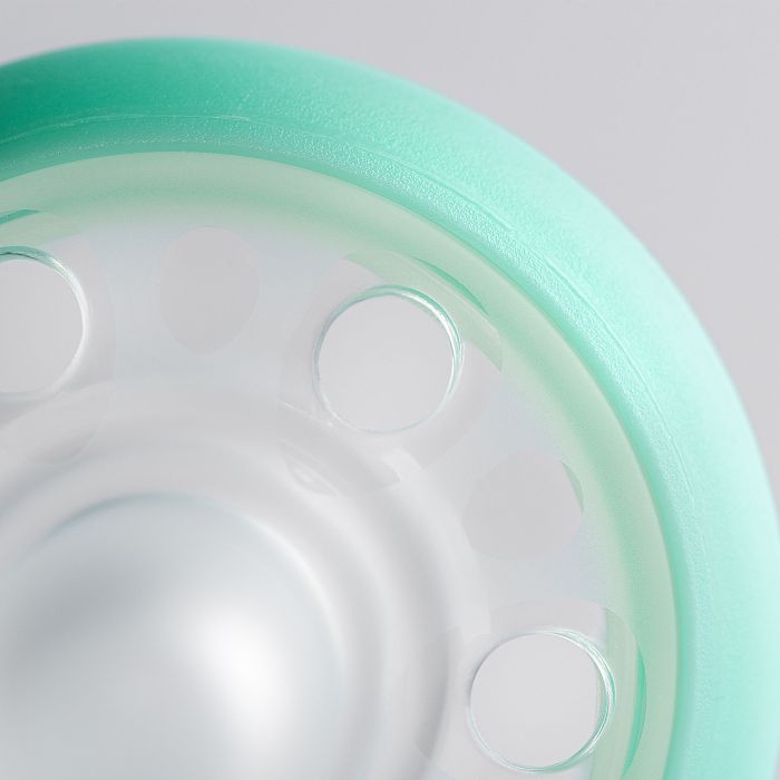 Close up of pacifier on a grey background