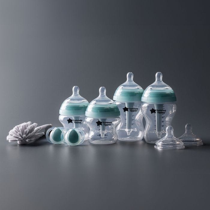 Newborn starter set against a grey background