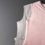 Two baby sleeping bags on a grey background