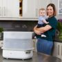 Mum and baby with steriliser
