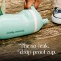 Image of toddler picking up an insulated sporty spout cup off the ground with product USP tagline below it