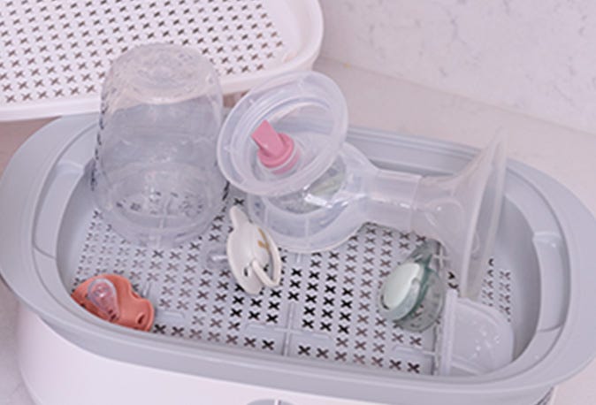 Silicone Breast pump, Ultralight soothers and Natural Start bottle all on Supersteam steriliser tray