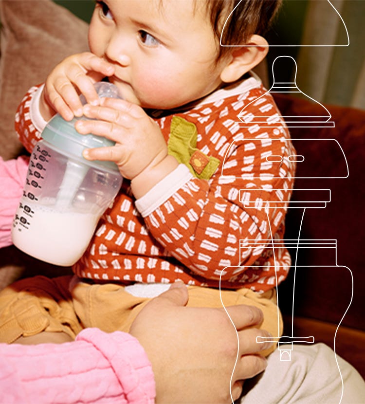 Baby holding advanced anti-colic bottle